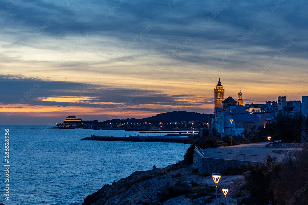 Fototapeta premium Sunset in a coastal town in front of the sea