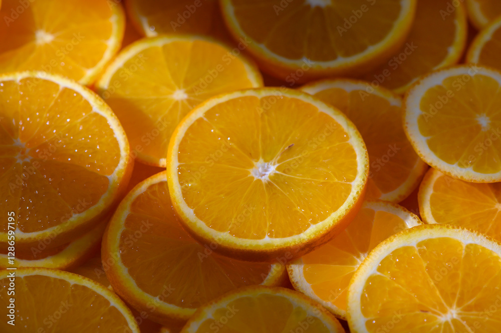 Brightly sliced oranges create a vibrant display in a sunny marketplace Brightly sliced oranges create a vibrant display in a sunny marketplace