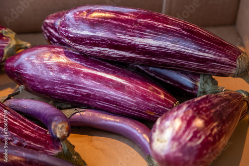 Wallpaper Mural Striped purple eggplants with glossy skin at a farmers market. Ideal for food photography, organic produce, healthy eating, and vegetarian meal preparation Torontodigital.ca
