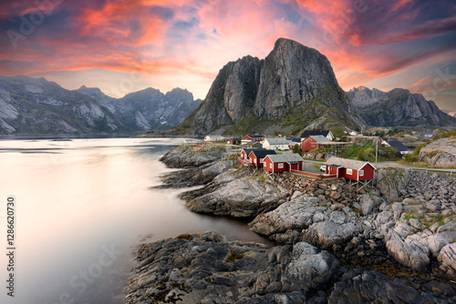 Beautiful sunrise over Hamnoy, fishermen village with the typical red houses of the Lofoten Islands, Norway photo