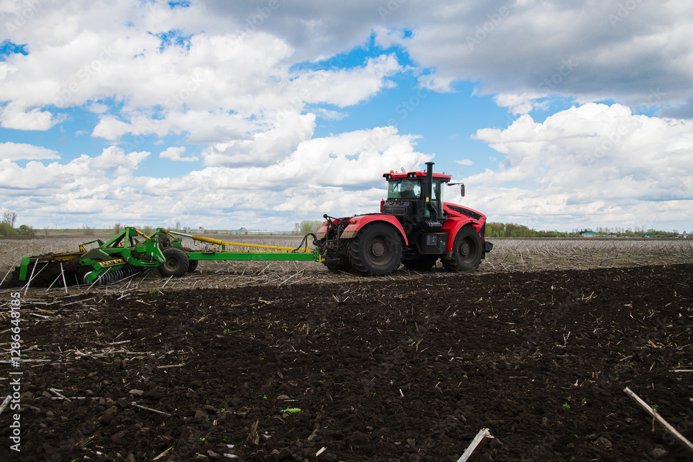 Fototapeta premium Versatile cultivator with disk, cultivate, harrow tools for secondary tillage