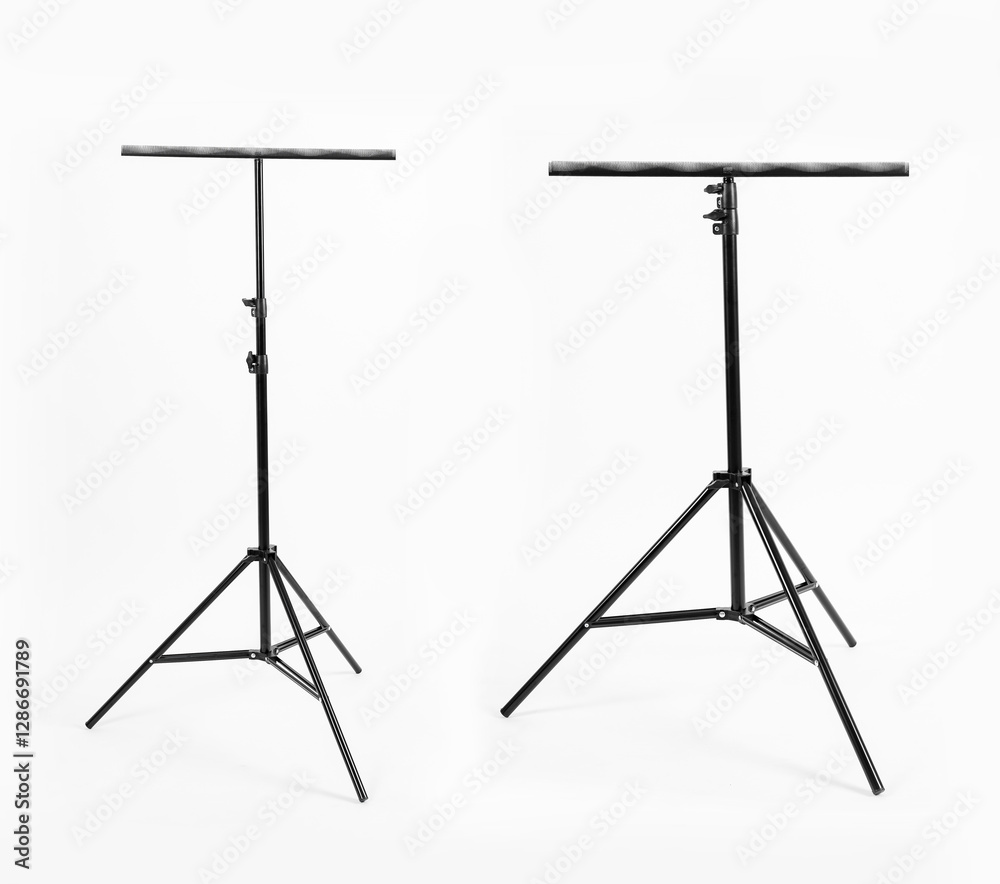 Black tripod with a metal comb. White background. Black tripod with a metal comb. White background.