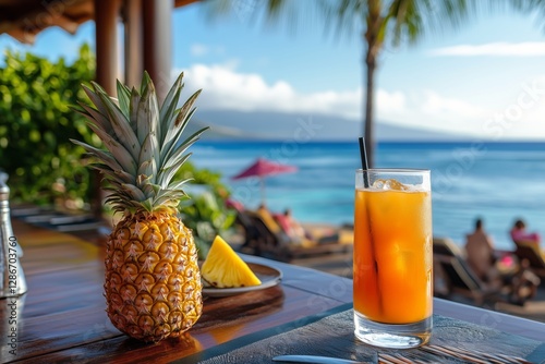 Refreshing Pineapple Drink on a Table With a Whole Pineapple in a Tropical Be...