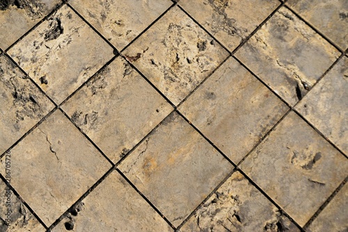 Beige-brauner alter Feldsteinboden als Hintergrund