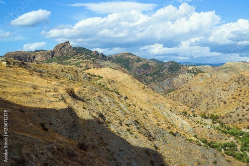 Olive groves and mountains around Ghost Town, Pentedattilo Village, Calabria, Italy, Europe photo