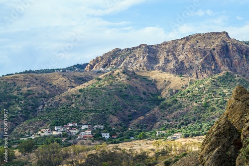 Olive groves and mountains around Ghost Town, Pentedattilo Village, Calabria, Italy, Europe photo