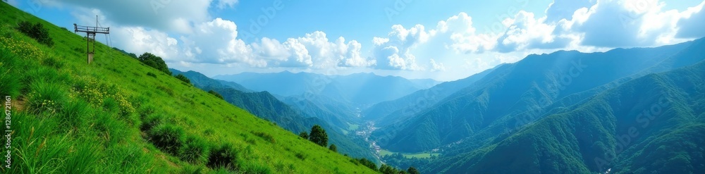 Naklejka premium Lush greenery covers the slope of mountains that touch the blue sky above, mountain slope, foliage