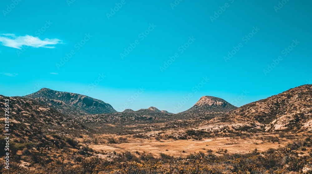 Sunny mountain landscape, dry plains, clear blue sky Sunny mountain landscape, dry plains, clear blue sky
