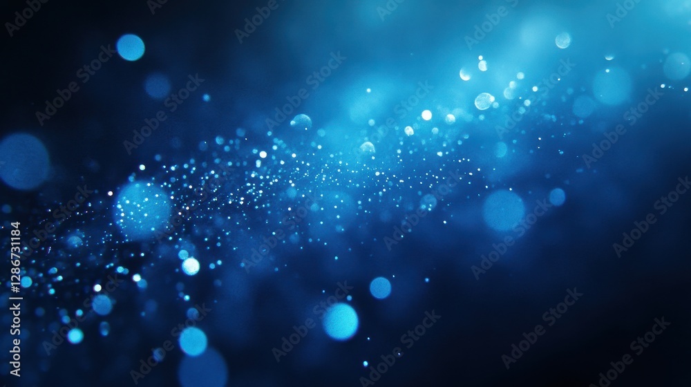 Fototapeta premium A mesmerizing abstract image featuring shimmering blue bokeh lights against a dark background, creating a dreamy atmosphere.