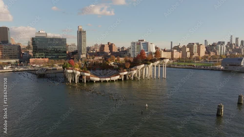 Aerial view of Little Island, a public park in Chelsea neighborhoods of Manhattan, New York City, during a sunny autumn day Aerial view of Little Island, a public park in Chelsea neighborhoods of Manhattan, New York City, during a sunny autumn day