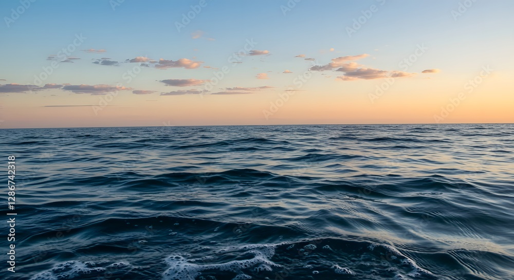 Fototapeta premium ocean waves at sunset with sky reflections