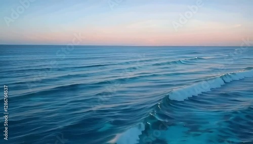 Calm ocean waves ripple toward the horizon