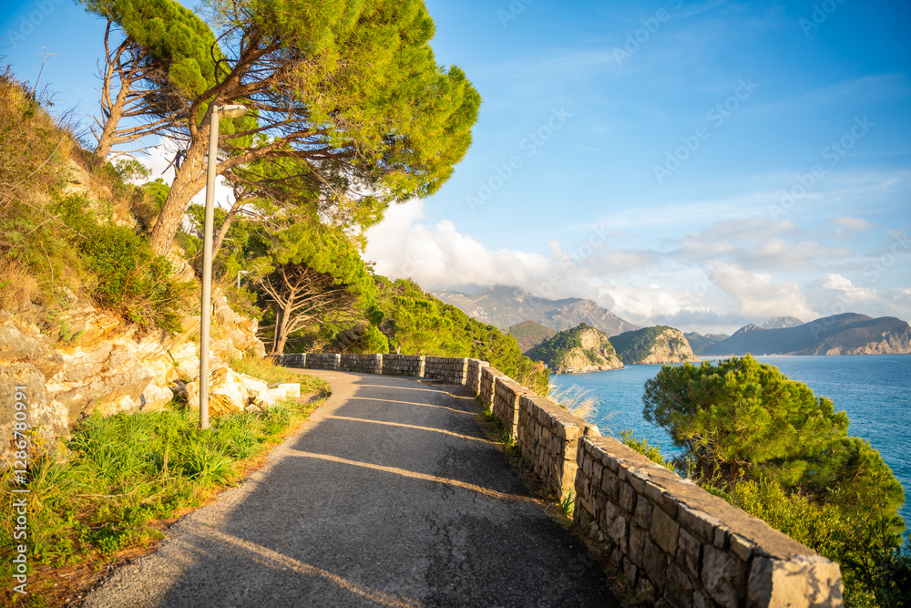 Pedestrian path to tunnel through a rock or mountain near Petrovac town in winter time, Montenegro. Pedestrian path to tunnel through a rock or mountain near Petrovac town in winter time, Montenegro.