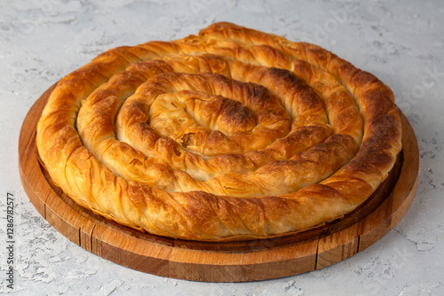 Turkish Tepsi Boregi, Round Borek, Tray pastry (Turkish name; rulo borek - ispanakli borek) photo