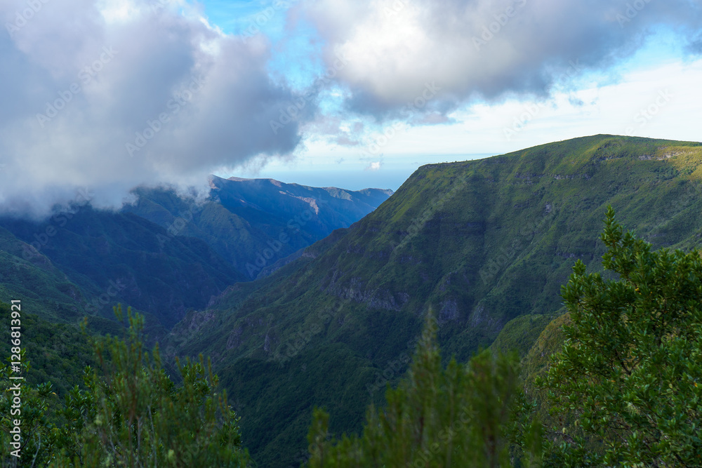 Fototapeta premium The valley in the mountains with cloudy sky.