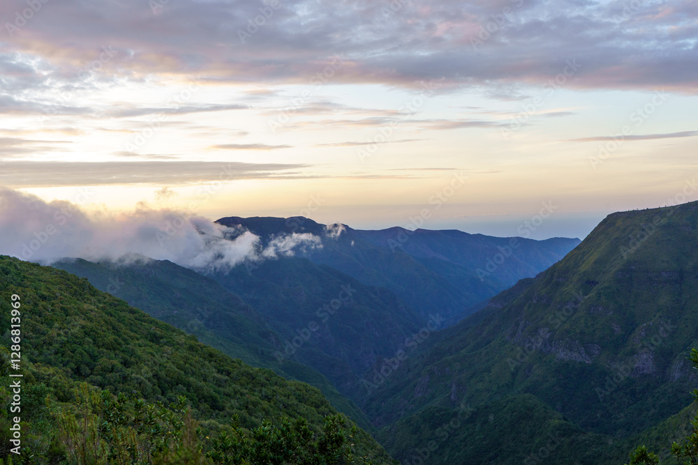 The valley in the mountains with cloudy sky. The valley in the mountains with cloudy sky.