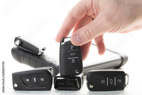 Production of car keys, Programming of car keys and repair.