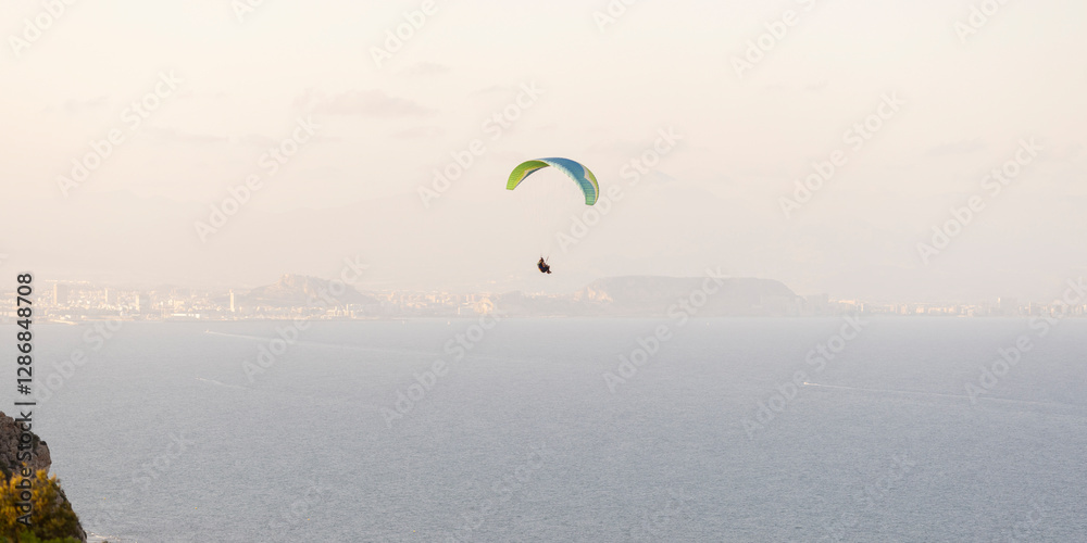 Paragliding by the sea. Mediterranean coast.