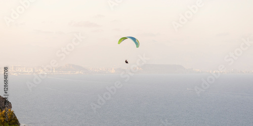 Obraz na płótnie Paragliding by the sea. Mediterranean coast. w salonie
