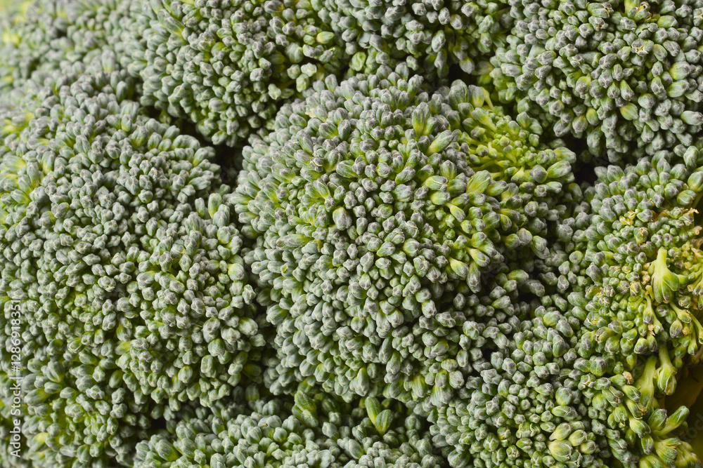 A close-up shot of a broccoli floret, highlighting its detailed texture and vibrant green color A close-up shot of a broccoli floret, highlighting its detailed texture and vibrant green color