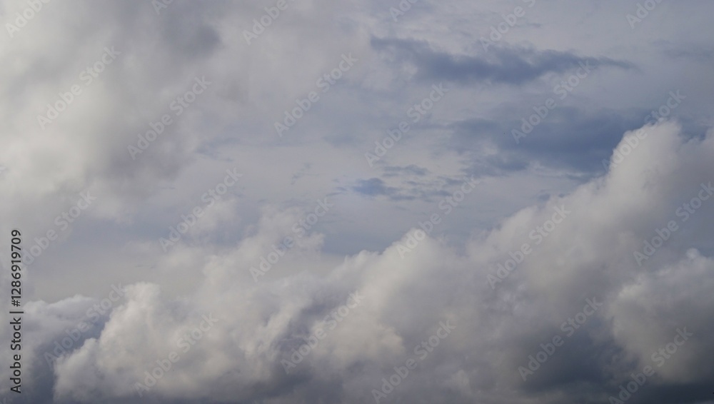 afternoon sky with white clouds and black clouds indicating cloudy weather afternoon sky with white clouds and black clouds indicating cloudy weather
