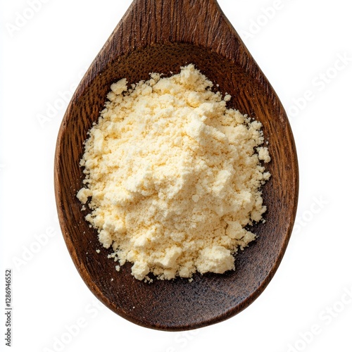 A wooden spoon holds a generous helping of pale yellow chickpea flour.  The fine powder is ready for cooking. photo