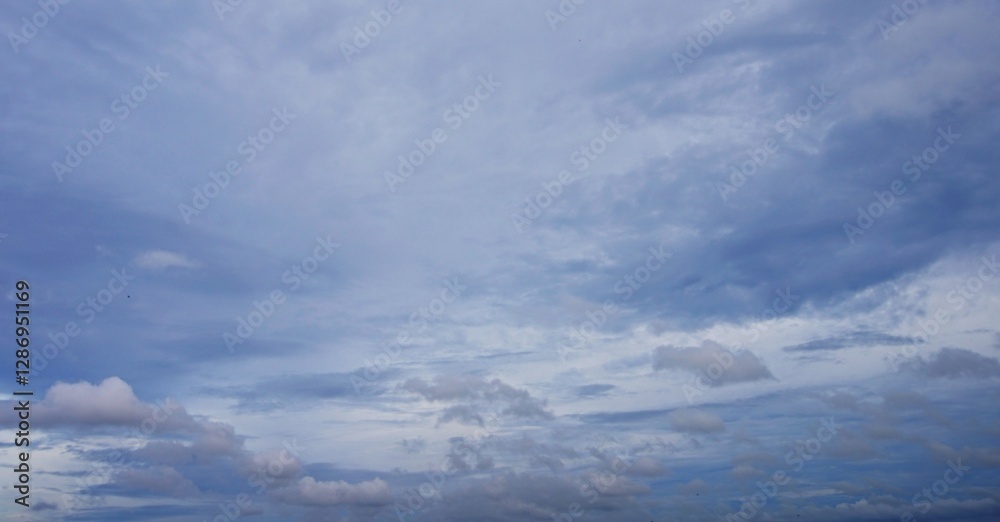 The clear afternoon sky with beautiful white clouds, looks natural, suitable for a background The clear afternoon sky with beautiful white clouds, looks natural, suitable for a background
