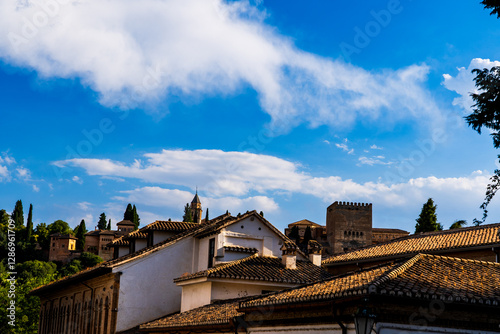 Moorish Alhambra Over Granada’s Rooftops: Centuries of Nasrid Splendor Amid Verdant Andalusian Cypress Silhouettes and Timeless Spanish Heritage
