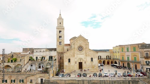 Experience the breathtaking aerial views of Matera, Italy in this cinematic drone footage. Captured on a partly cloudy day, these smooth, panoramic shots gracefully zoom over the entire city photo