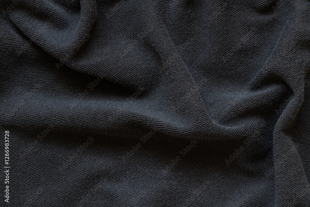 Fototapeta premium Plain black cotton fabric as background , black clothes