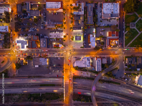 Ventura California Drone Aerial view at Sunset with city Lights appearing near the ocean over 101 traffic freeway photo