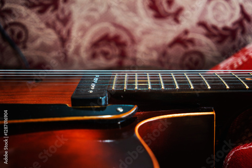 Canvas Print Archtop jazz acoustic guitar on the sofa