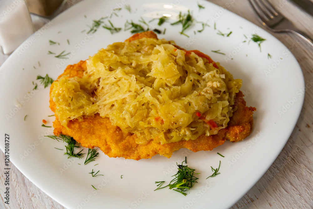 Grilled pork chop with sauerkraut - Polish dish. High quality photo Grilled pork chop with sauerkraut - Polish dish. High quality photo