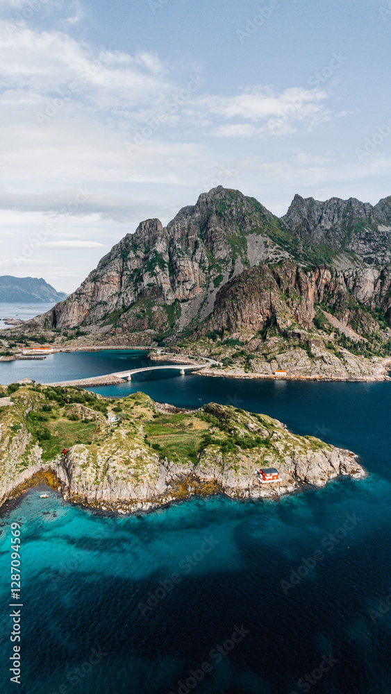 Aerial shot of a bridge connecting islands amidst dramatic mountains and turquoise waters in Norway. Norway, Lofoten Islands, August 2024 Aerial shot of a bridge connecting islands amidst dramatic mountains and turquoise waters in Norway. Norway, Lofoten Islands, August 2024