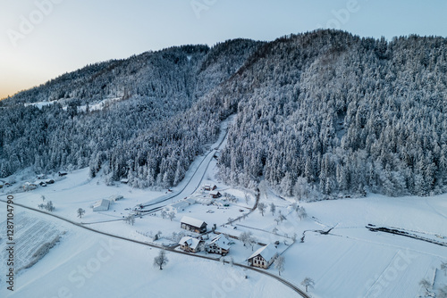 Obraz na płótnie Ski jumps of ljubno ob savinji, part of female ski jump world cup, viewed in early morning and snow covered grasslands and hills w salonie
