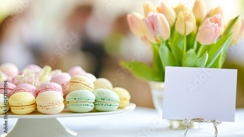 Elegant easter buffet table with colorful macarons and tulips. concept of festive celebration, spring decor, outdoor catering, sophisticated party setup. Copy space. mockup. blank card photo