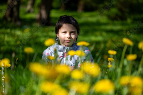 Portrait of little adorable girl walking in park
