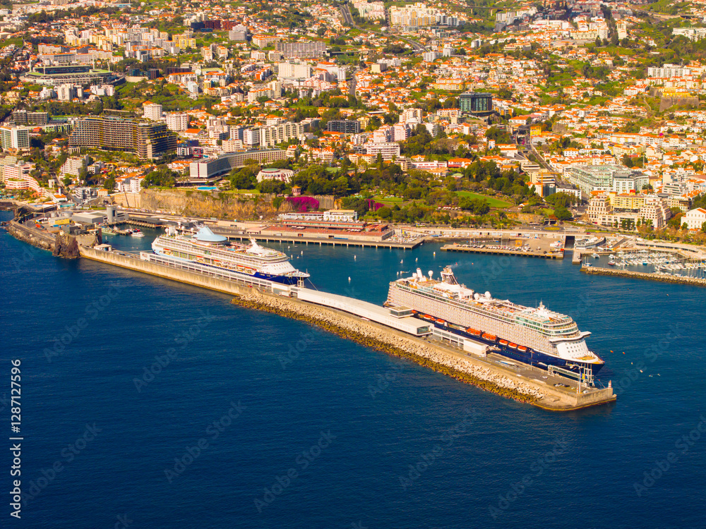 Luxury cruise ships docked in Funchal, Madeira showcasing ocean travel and scenic views Luxury cruise ships docked in Funchal, Madeira showcasing ocean travel and scenic views