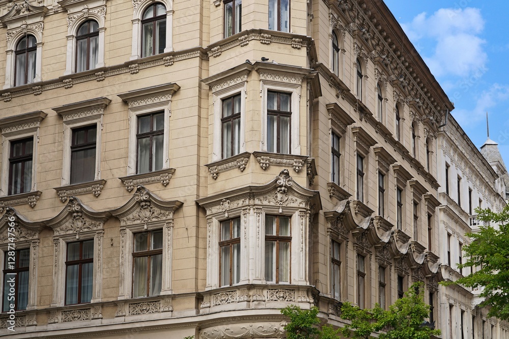 old apartment building with ornate decorations around window frame old apartment building with ornate decorations around window frame