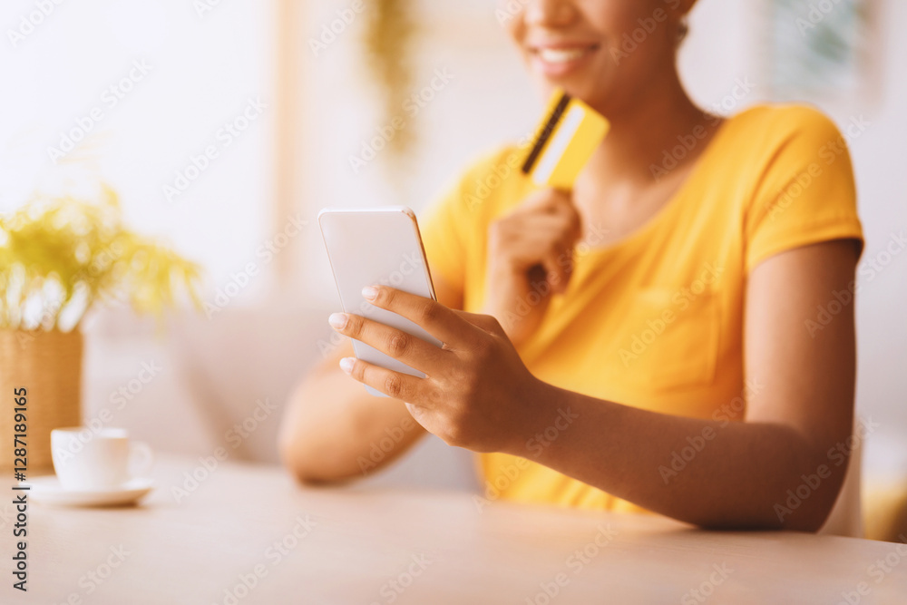 Making Financial Transaction. Closeup of african woman holding smart phone and credit card, focus on gadget Making Financial Transaction. Closeup of african woman holding smart phone and credit card, focus on gadget
