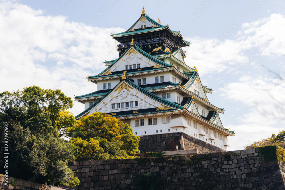 Fototapeta premium Osaka Castle, Osaka city, Japan, summer landscape vibrant view with a blue sky, Osakajo castle building, Kansai region, Osaka prefecture, travel to Japan