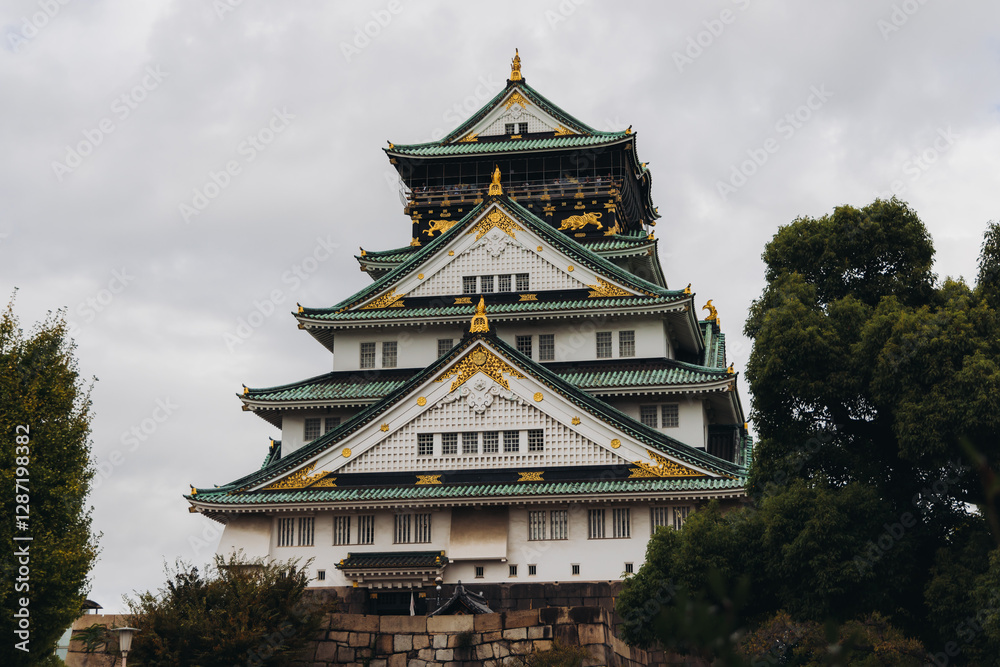 Fototapeta premium Osaka Castle, Osaka city, Japan, summer landscape vibrant view with a blue sky, Osakajo castle building, Kansai region, Osaka prefecture, travel to Japan