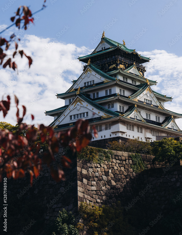 Fototapeta premium Osaka Castle, Osaka city, Japan, summer landscape vibrant view with a blue sky, Osakajo castle building, Kansai region, Osaka prefecture, travel to Japan