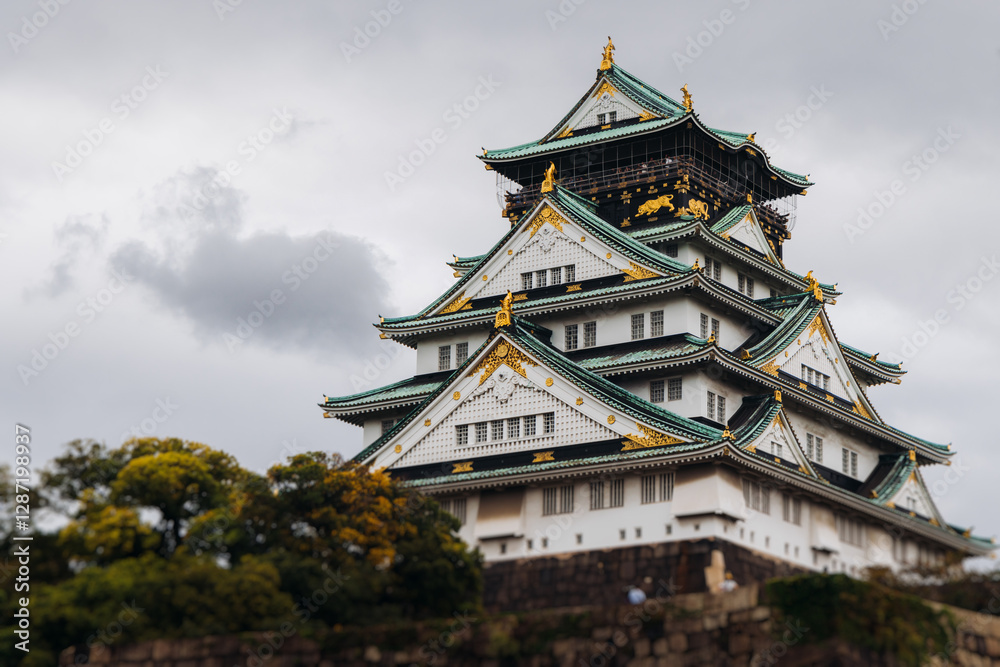 Fototapeta premium Osaka Castle, Osaka city, Japan, summer landscape vibrant view with a blue sky, Osakajo castle building, Kansai region, Osaka prefecture, travel to Japan