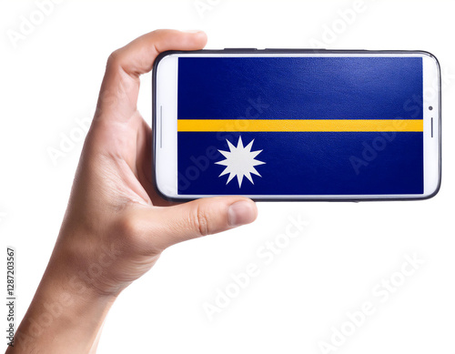 ナウルの国旗が画面に表示されているスマートフォンを持つ手。白背景。(Hand holding smartphone, screen is Nauru flag. on white background.)
 photo