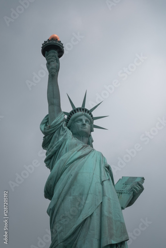 Close-up view of the Statue of Liberty in New York City, highlighting its iconic torch and face.