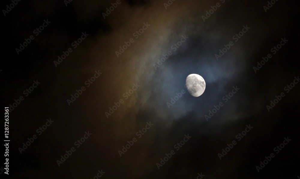 Moon shrouded in colorful clouds Moon shrouded in colorful clouds