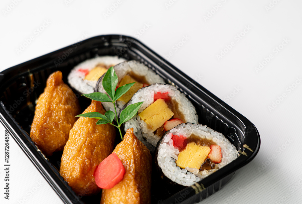 Close-Up of Sushi Rolls and Inari: A Platter Showcasing a Colorful Array of Maki Rolls with Various Fillings, Complemented by Flavorful Inari Sushi Pockets, Highlighting the Variety and Appeal of Japa Close-Up of Sushi Rolls and Inari: A Platter Showcasing a Colorful Array of Maki Rolls with Various Fillings, Complemented by Flavorful Inari Sushi Pockets, Highlighting the Variety and Appeal of Japa