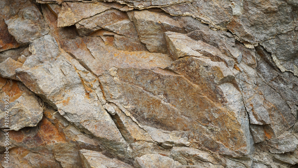 Light brown orange rusty beige gray white stone rock granite background. Mountain surface texture. Close-up. For design.