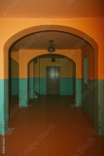 underground limiinal space in orange and light teal